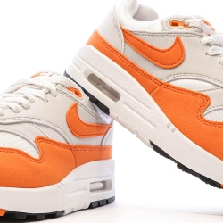 Baskets Blanches/Orange Femme Nike Air Max 1